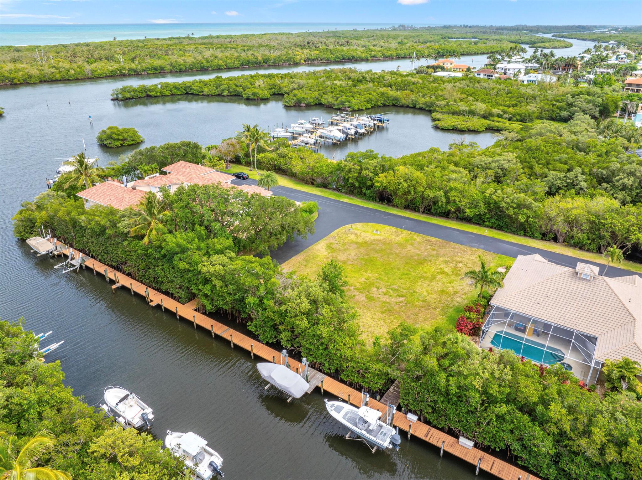 1/4 acre waterfront lot ready for your new home. Boat dock with New 14000 LB lift directly behind property. No fixed bridges and minutes to Pecks Lake and a quick ride to the inlet. Governors Landing is a gated community with additional boat storage, ramp and pier. Welcome to the charming town of Hobe Sound with pristine beaches and championship golf courses. Great location close to many casual & fine restaurants and shopping plazas. Boat, Fish, Dive, Snorkel, Jet Ski, Paddle Board and enjoy every possible water sport you can think of from your private waterfront oasis.