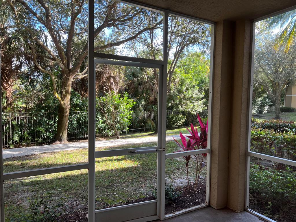 Beautifully updated and maintained first floor spacious Hibiscus model with a garage and storage unit facing the Emerald Dunes golf course. This is the largest one bedroom plan in the community and has a private location near the entrance/exit. This property has many upgraded features such as impact windows, a covered screened patio, quartz countertops, crown molding, updated cabinets and flooring, large walk in closet, garden tub and tile on a diagonal in the living area. Emerald Dunes is a gated community minutes to downtown and has easy access to the turnpike and fabulous amenities such as a resort style pool, fitness center, tennis courts, dog walking stations and on site security. This beautiful apartment will not be on the market for long. Water, garbage and basic cable are included
