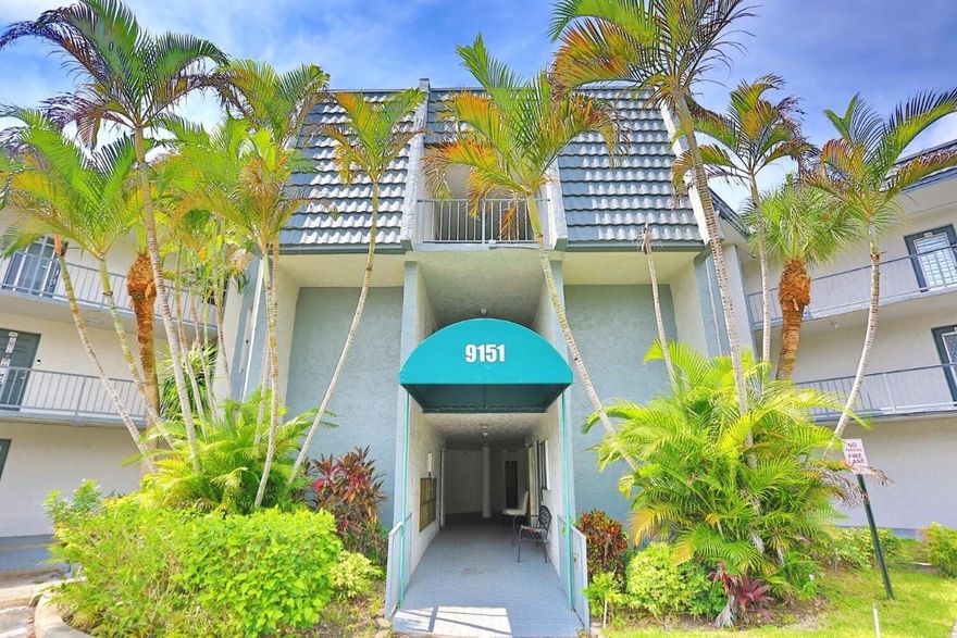 Beautifully maintained 2-bedroom, 2-bath condo in the desirable 55+ Lime Bay community. Located on the third floor with elevator access, this unit features a split-bedroom layout, updated bathrooms, brand-new bedroom carpets, and a mix of tile and carpet flooring. Hurricane impact windows throughout provide added security and energy efficiency. The screened-in balcony offers peaceful garden views, perfect for relaxing.The spacious primary suite includes a walk-in closet and en-suite bath. A newer A/C unit ensures year-round comfort.Community amenities include clubhouse, swimming pool, tennis/pickleball courts, shuffleboard, Bocce Ball, bingo, weekly barbecues, and monthly social events. Conveniently located near shopping, dining, medical facilities, and major roadways.