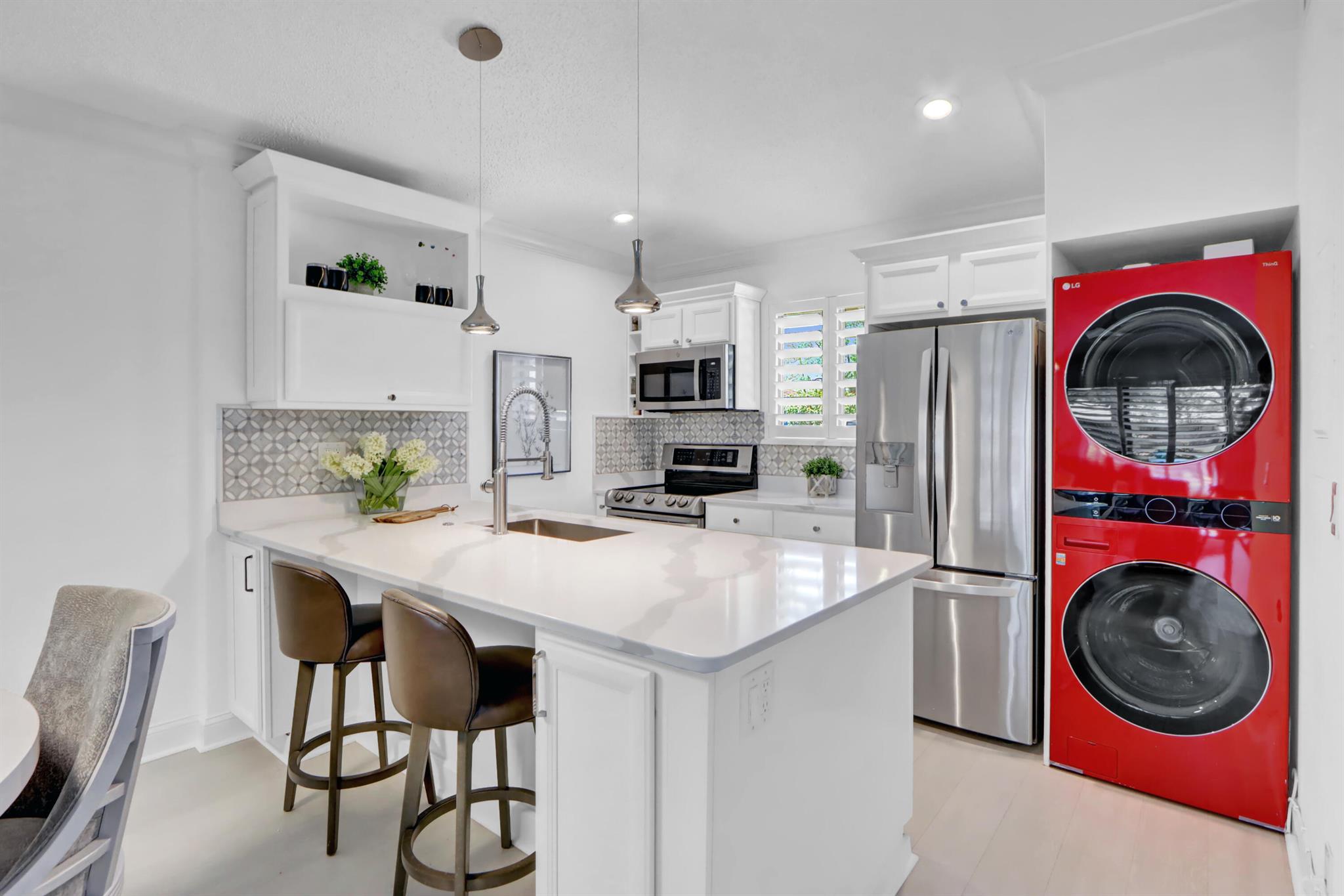 SOLD TURNKEY! Experience luxury redefined in this totally renovated 2-bed, 2-bath villa located within the prestigious PGA National Golf Club. Every detail of this stunning home has been thoughtfully redesigned to create a seamless blend of modern elegance and timeless charm.Open-concept living space flooded with natural light, accentuated by high ceilings and exquisite finishes. The large island accents the open kitchen, boasting custom cabinetry, quartz counter-tops, and state-of-the-art stainless steel appliances, perfect for culinary enthusiasts & entertaining alike. Spacious master suite, featuring a beautifully appointed ensuite bathroom w/ vanity and luxurious walk-in shower.Indulge yourself in the resort-style living with access to PGA National's world-class amenities!