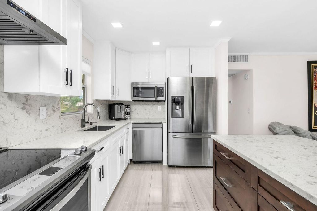 Photo of 92 Valencia Drive #D, Delray Beach, FL 33446 (MLS # B26020961)