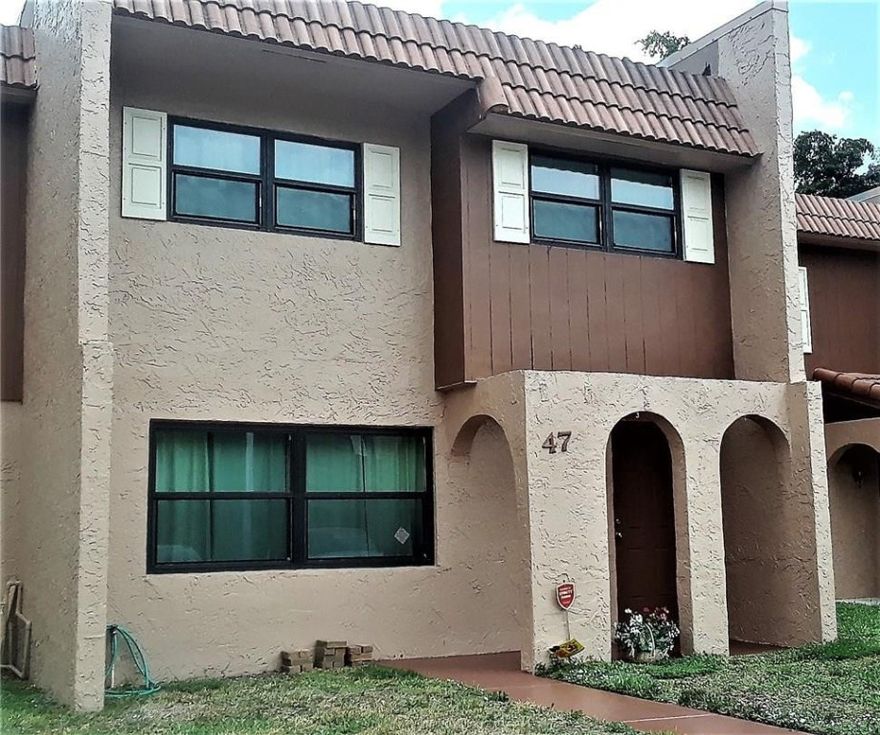 Spacious & updated townhome located in a convenient location. Features include all hurricane impact windows, laminate & tiled flooring, neutral décor, updated kitchen & baths with newer cabinetry & granite counter tops. 1st floor w/ living, family, dining, kitchen w/ breakfast bar, & powder room. Large screened patio w/ additional storage. Upstairs features large master suite w/ glass doors leading to 2nd floor balcony. Master bath w/ separate vanity area. Hallway leads to 2 large bedrooms & updated bath.