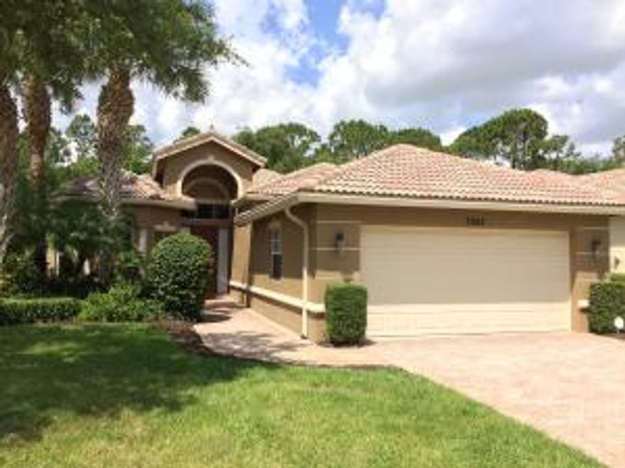 Delightful three bedroom home in the Greenbrier section of PGA Village. A formal entryway leads you in to an expansive living room with coffered ceilings. Tile floors with wood laminate in the bedrooms. Neutral colors and crown moulding throughout. View the garden out back from the bay windows of the breakfast area. Or have a formal meal in the dining area off the kitchen. The kitchen has tiled backsplash and Corian counters.The master suite also has tray ceilings with crown moulding and a bay window view of the back garden. Through the hallway to the bath are two closets. Dual, separate sinks, a walk-in shower, and soaking tub complete the master bath. The second bedroom is near the second bath down the hallway towards the indoor laundry room. There is a double-door entry to (see ''more'' the third bedroom at the front of the home. This room has a walk-in closet and could also function as a den or office. 

The driveway, walkways, and back patio are brick pavers. Screened lanai. Exterior recently painted and hot water heater  is newer. The asking price can include all the furniture which would make this home move-in ready. Measurements approximate.