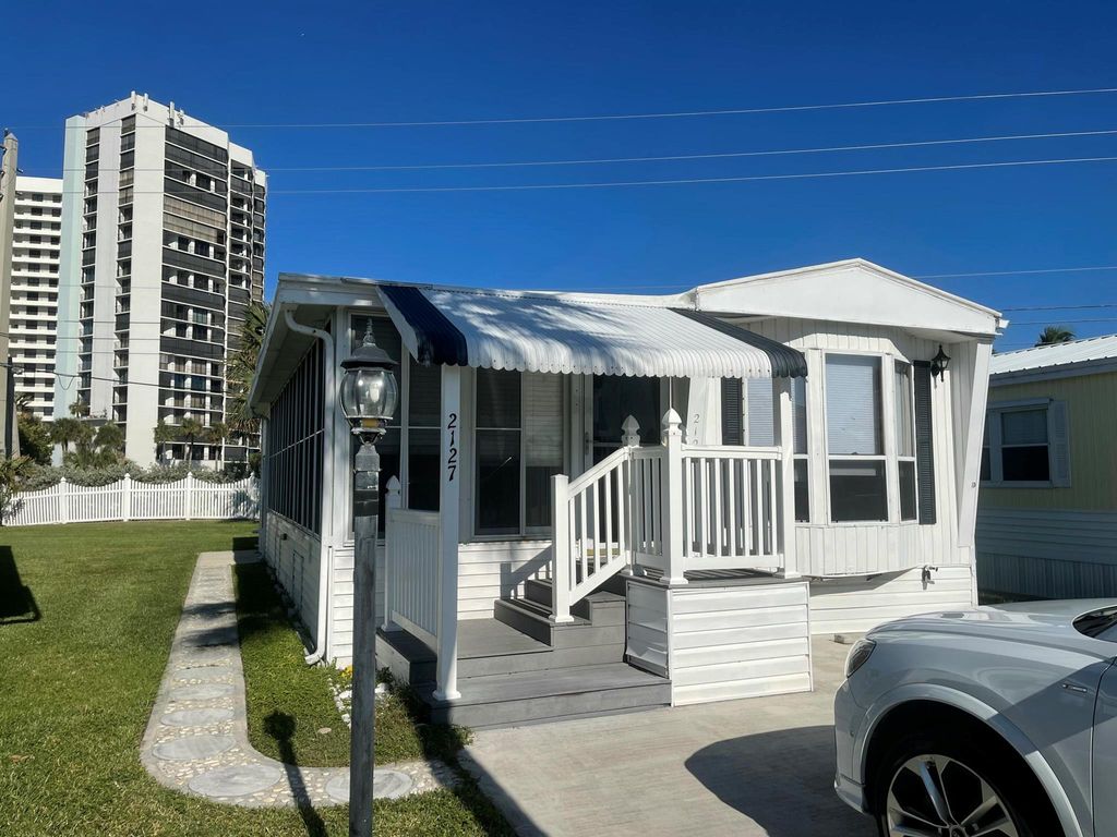 Photo of 2127 Nettles Boulevard, Jensen Beach, FL 34957 (MLS # R11044975)