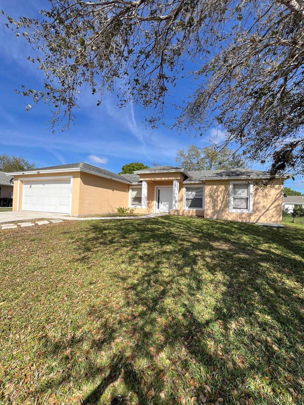 Photo of 5004 NW Fitzgerald Avenue, Port Saint Lucie, FL 34984 (MLS # R11065144)