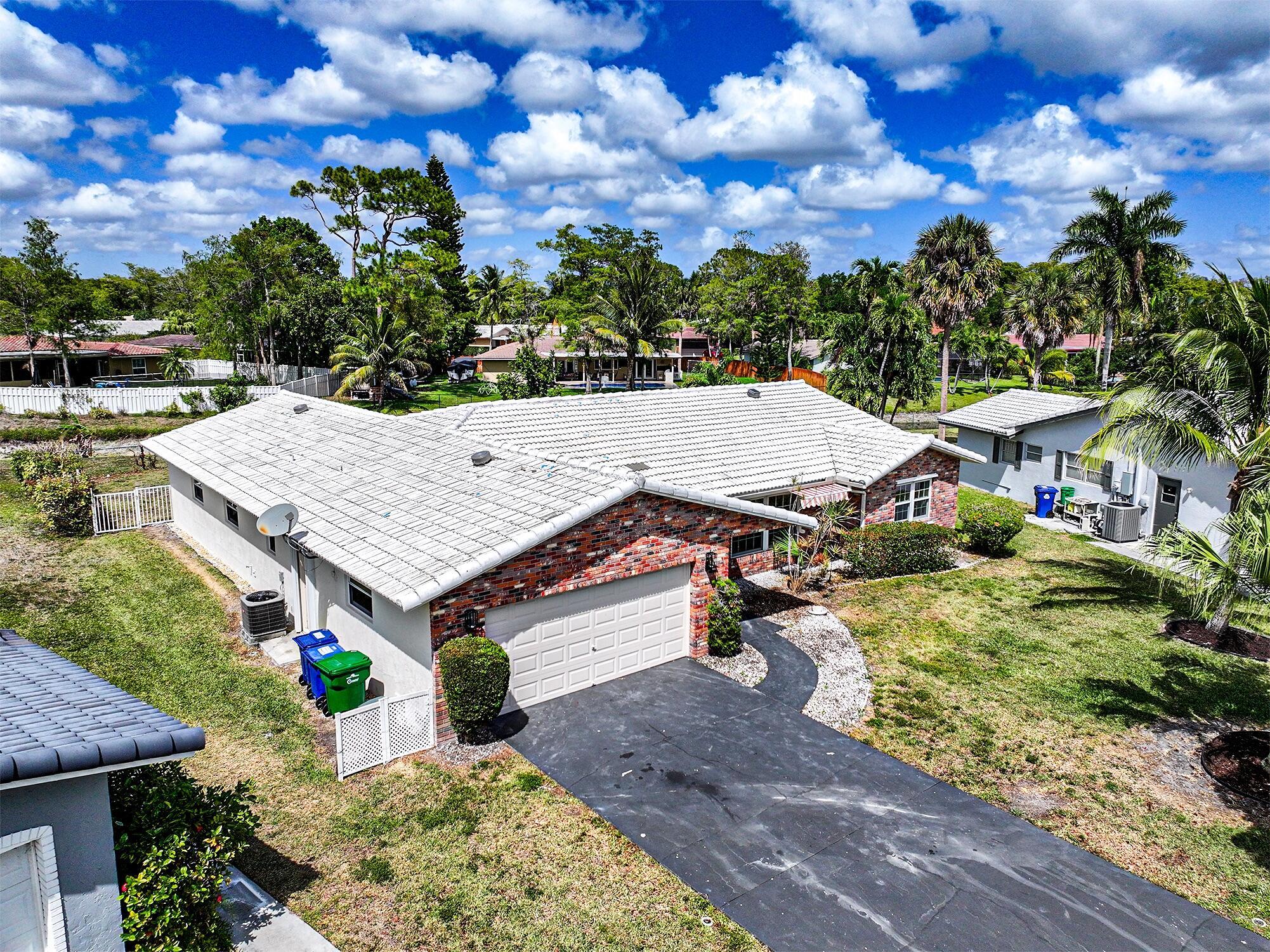 ''Airbnb'' & ''VRBO'' Short Term leasing availability. New home set on a large, private, fenced waterfront lot - offering both tranquility and security. The outdoor area is perfect for family living with a baby barrier fence around the pool for added safety.Inside, you'll find beautiful laminate floors throughout the 4 bedrooms, living room, and family room, providing a warm, cohesive look. The ceramic tile in the kitchen, dining room, master bedroom, and breakfast area adds a touch of elegance and is easy to maintain.This home boasts two cabana baths, ideal for hosting guests or enjoying a relaxing retreat. Impact glass windows and sliders provide both protection and natural light, ensuring your home stays secure and bright year-round.