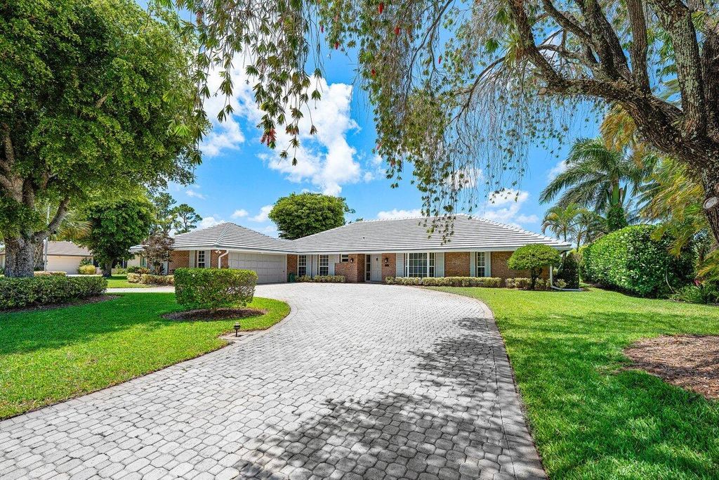 Photo of 489 S Country Club Drive, Atlantis, FL 33462 (MLS # R11139797)