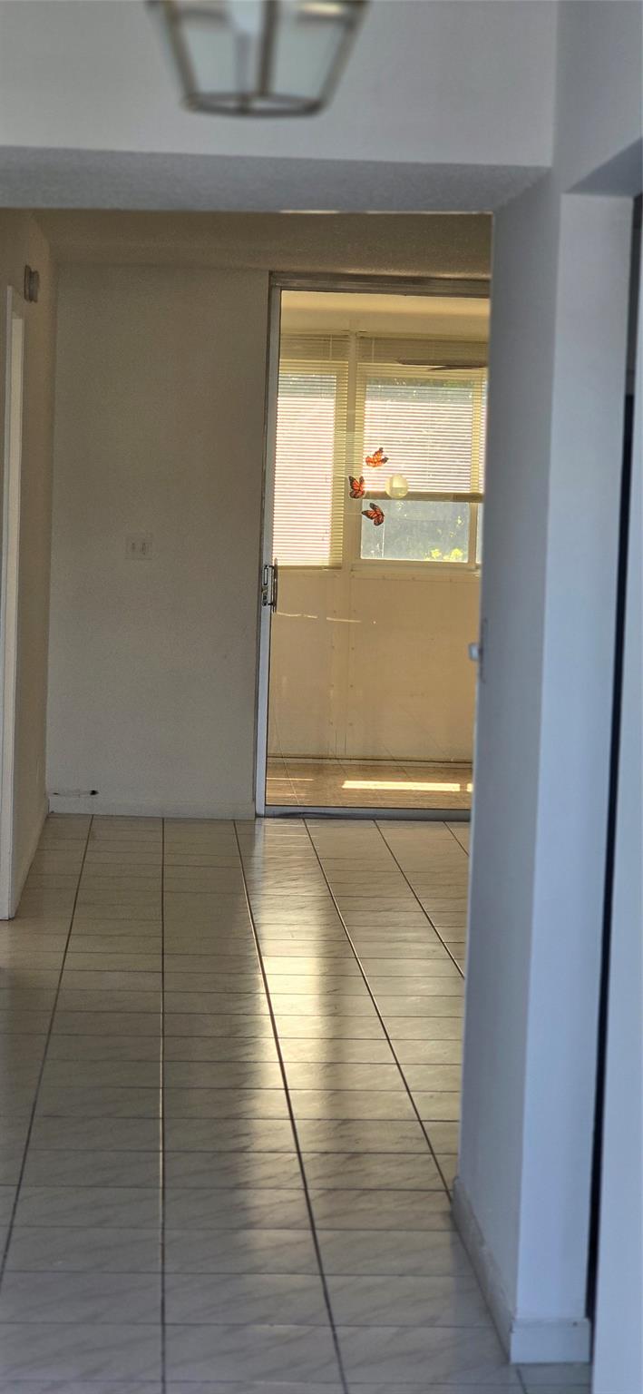 Spacious and bright 2-bed, 2-bath + den/office condo in Palm Springs 2 (55+ community). Approx. 1,000 sq ft with enclosed balcony and stunning golf course views. Located on the 3rd floor near a newly installed elevator (July 2025). Features large rooms, walk-in closet, tile/wood flooring, and nearly new fridge & stove. Enjoy resort-style amenities: outdoor and indoor heated pools, clubhouse, movie theater, restaurant, pool tables, dance/game rooms. New roof and elevator (2025). Fully funded HOA with completed 40-year inspection, reserve study & SIRS. All Assessments FULLY PAID. Must own 2 years before leasing.
