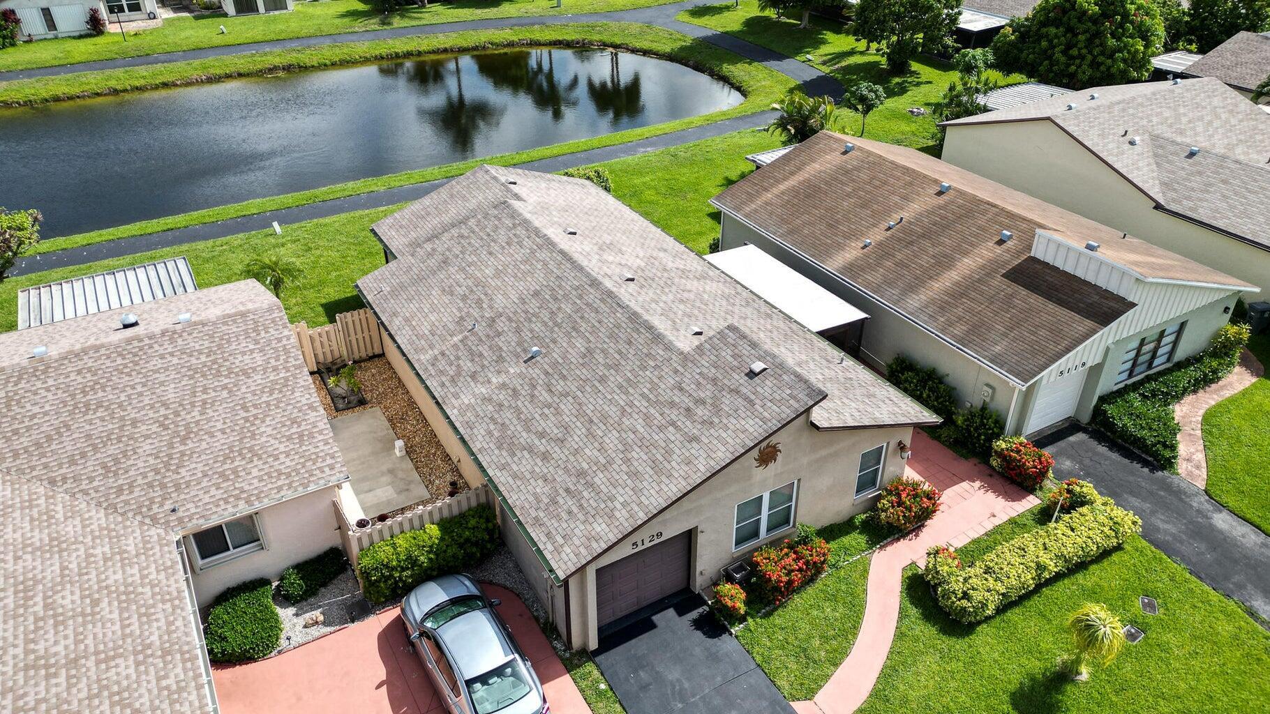 Welcome Home to Mirror Lakes, Lakefront Living at Its Finest! This stunning home offers serene lakefront views & modern upgrades throughout.The beautifully renovated kitchen features white panel cabinetry, granite countertops, tile backsplash, & updated appliances. Both bathrooms have been beautifully renovated. The home is equipped with hurricane impact windows & doors for peace of mind. The 3rd bed/family/flex room overlooks the lake, offering the perfect space for relaxation or entertaining. Additional highlights include new Luxury Vinyl floors in 2 bedrooms, 18'' tile, high-hat lighting, A/C & water heater (2020). A seamless blend of indoor & outdoor living with an open lanai, a screened & covered patio & plenty of space to soak up the stunning views. Schedule your showing today. 55+