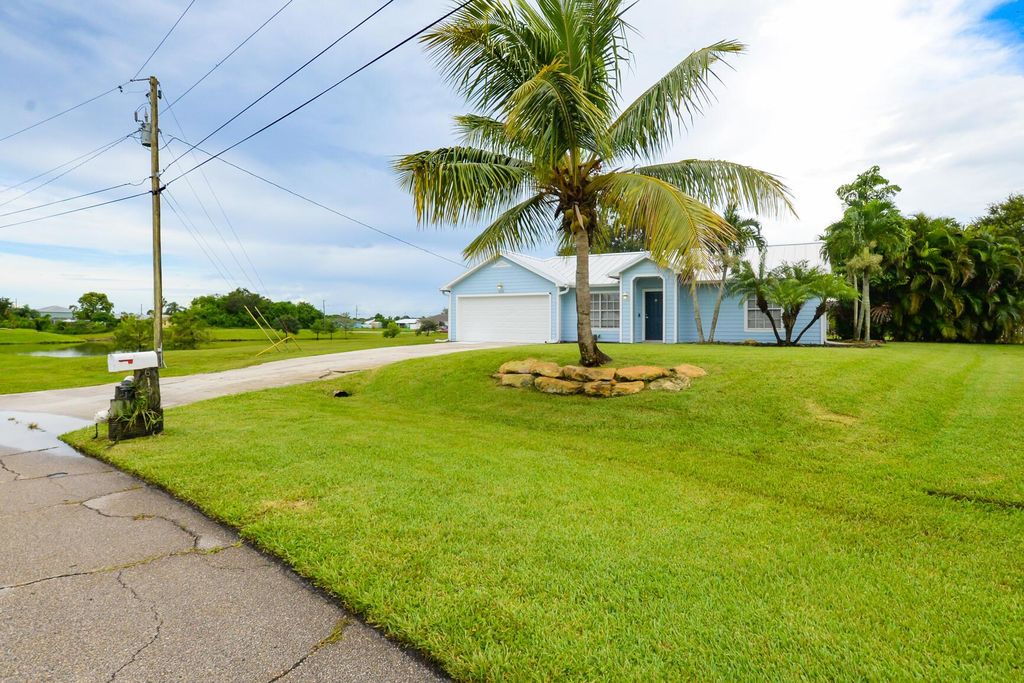 Photo of 619 SW Bradshaw Circle, Port Saint Lucie, FL 34953 (MLS # R10912112)