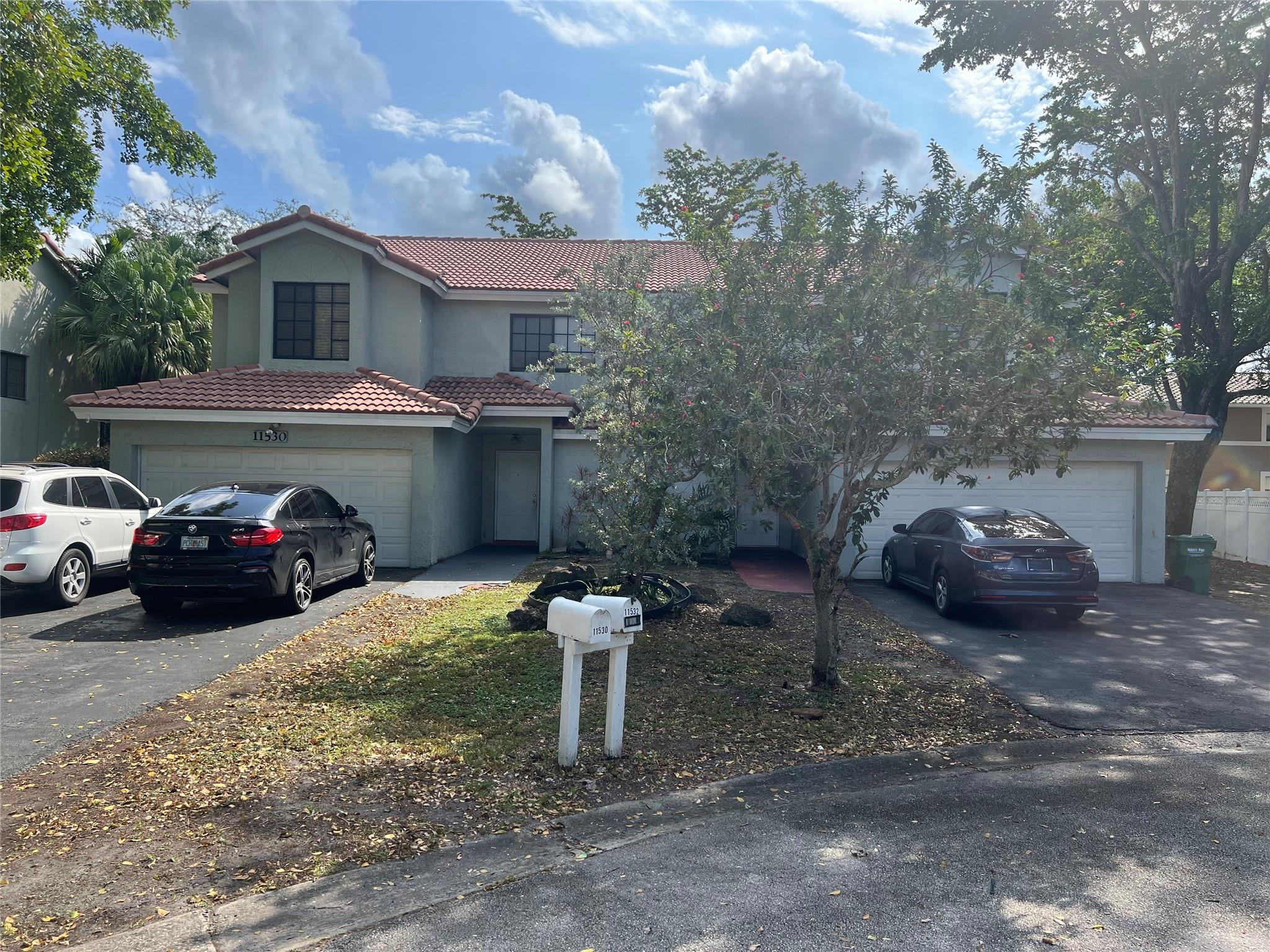 VERY SPACIOUS DUPLEX IN NORTH CORAL SPRINGS. FEATURES 3 BEDROOMS, 2 1/2 BATHROOMS WITH A 2 CAR GARAGE ON EACH SIDE. 2 STORIES. TILE FLOORS THROUGHOUT. OPEN FLOOR PLAN. VAULTED CEILINGS. NEWER STURDY BARREL TILE ROOF - 6 YEARS OLD. HEW 5 TON A/C JUST INSTALLED ON ONE SIDE. HUGE FENCED YARD FOR KIDS TO PLAY OR HAVE A PARTY / BAR-B-QUE. CUL-D-SAC. NEWER STURDY BARREL TILE ROOF. 25-30 MINUTES TO FORT LAUDERDALE INT'L AIRPORT. 20 MINUTES TO WHITE SAND BEACH. 25 MINUTES TO WORLD FAMOUS SAWGRASS MILLS MALL FOR SHOPPING & UPSCALE RESTAURANTS. NO HOA.