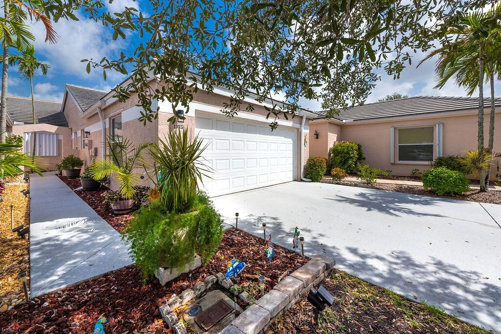 Photo of 1035 Island Manor Drive, Greenacres, FL 33413 (MLS # R11159387)