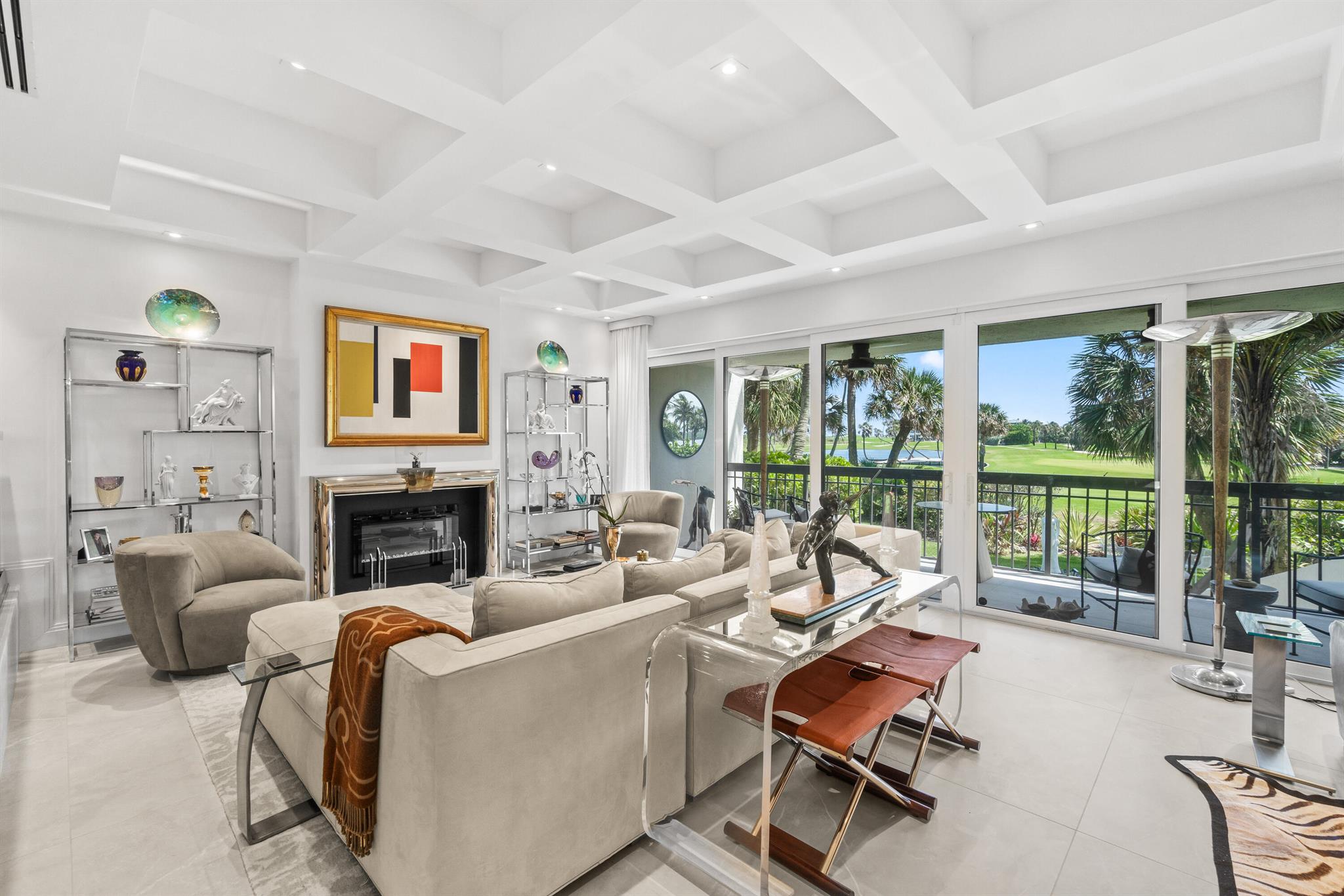 Sun-filled southern exposure with stunning views of the Palm Beach Par 3 Golf Course, Intracoastal, and Ocean. This modern 3BR/2.5BA home is fully renovated and professionally furnished to perfection. Features include a high-end kitchen with sitting area, spacious living and dining rooms, and a terrace leading to a private garden. An elevator connects all levels from the 2-car garage to the top-floor bedrooms. The primary suite offers soaring ceilings, a private terrace, spa-like bath, and generous closets. Two additional bedrooms, a full bath, and laundry complete the upper floor. Tres Vidas offers a manned gate, tennis court, and deeded beach access. Next to Palm Beach Par 3 Golf Course and Palm Beach Tennis Center. Minutes to Worth Avenue and top resorts.