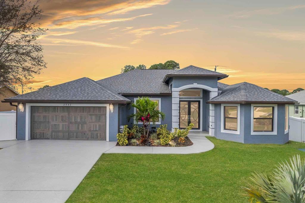 Photo of 3942 SW Helmlinger Street, Port Saint Lucie, FL 34953 (MLS # R10945183)