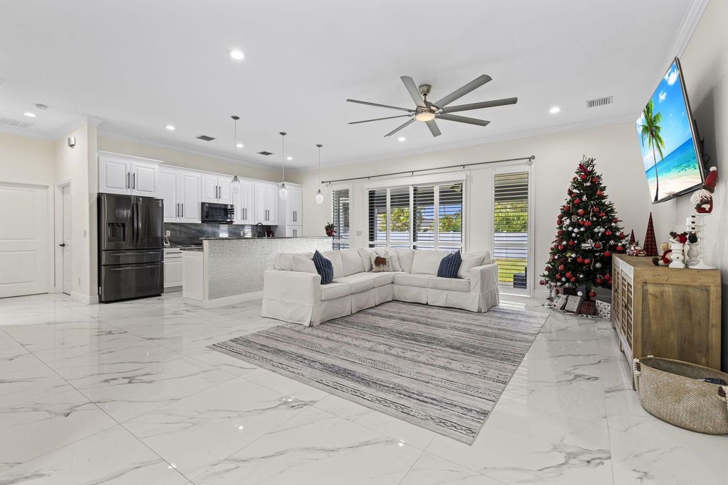Photo of 3942 SW Helmlinger Street, Port Saint Lucie, FL 34953 (MLS # R10945183)