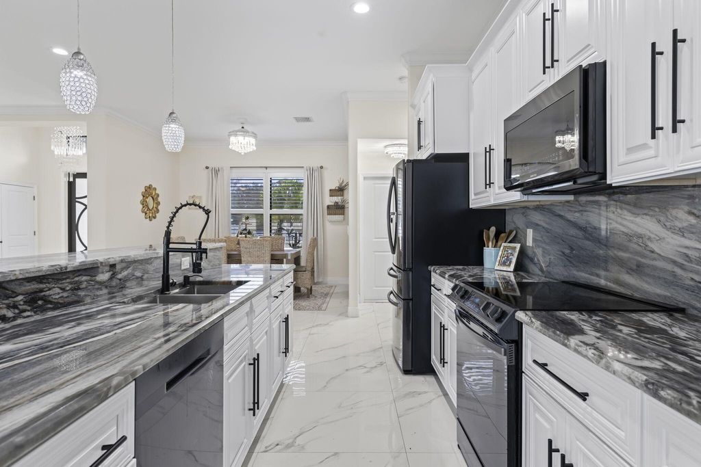 Photo of 3942 SW Helmlinger Street, Port Saint Lucie, FL 34953 (MLS # R10945183)