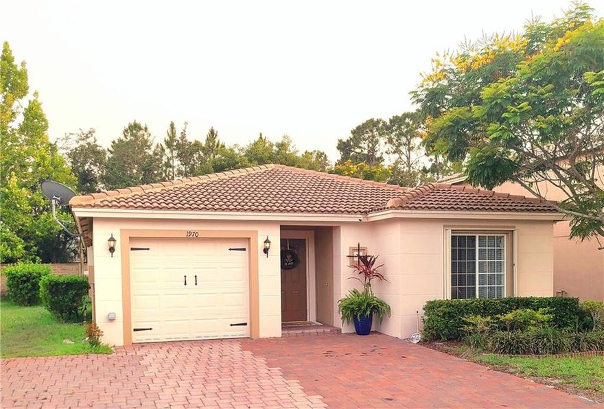 3/2/1 in guard gated community. Close proximity to 95. Upgrades include brand new Stainless steel appliances, Range with built in air fryer, granite countertops, crown moulding throughout, enclosed patio addition with extended pavers and outdoor TV. Large floor plan with den that can easily be converted to a 4th bedrrom. Extended driveway with room for 4 cars. Tankless water heater 2021. Exterior electrical outlet for EV charging. Accordian hurricane shutters. Ring doorbell. Community features many amenities including swimming pools, kiddie pool, gym, clubhouse, basketball, tennis, playground. High speed internet included in low HOA.