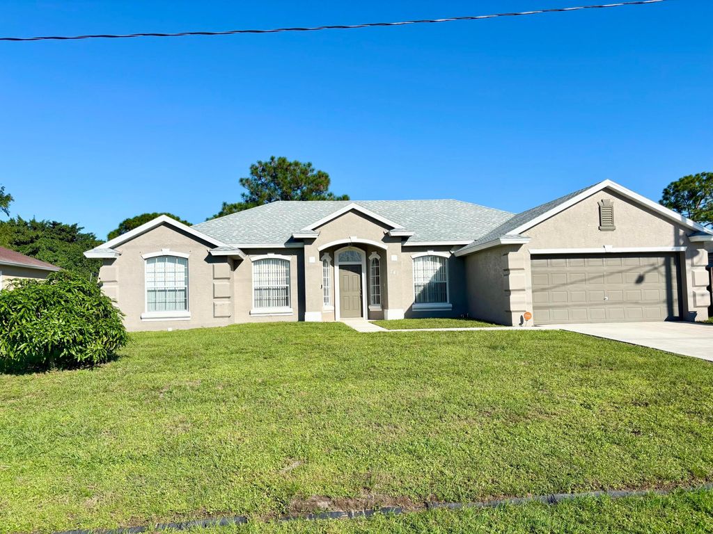 Photo of 741 NW North Macedo Boulevard, Port Saint Lucie, FL 34983 (MLS # R11132121)