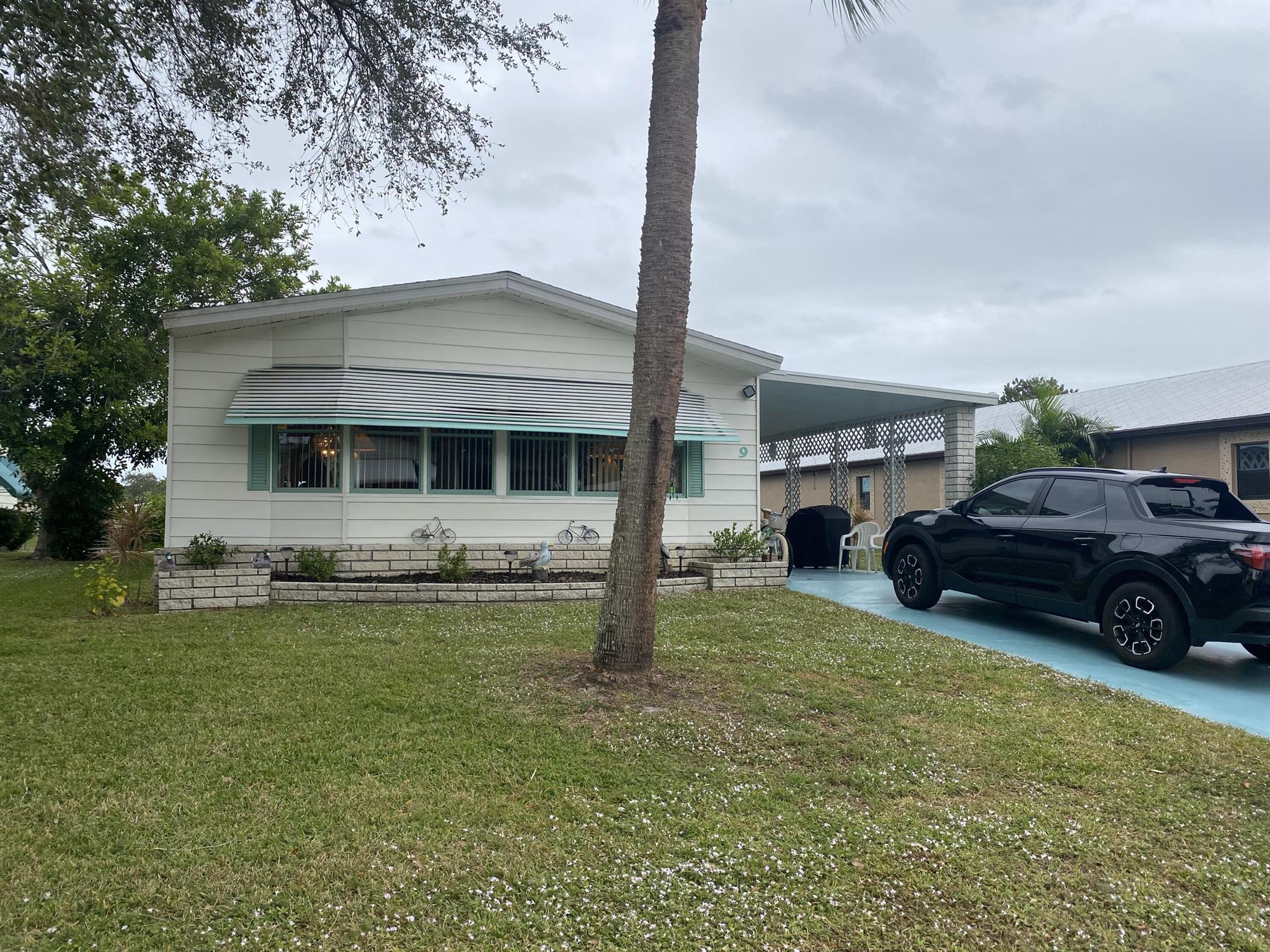 what a water view! Are you looking for a spacious home with not only a Florida room that overlooks the water but also has an outside deck?! Look no further, this fully furnished home has it all! Plenty of interior room with both a living room and family room for entertaining, large kitchen with amply counter and cabinet space, large kitchen island and a large pantry. Both bedroom rooms have their own bathrooms, and the main bathroom will not disappoint as it has both a shower and a bathtub and a spacious Walk-in closet. The Florida room is about as big as they come wit a fabulous view of the lake, perfect for relaxing after a busy day at the club house enjoying all the amenities Spanish Lakes has to offer! 55+ community included in your monthly fee, you have a private golf course,