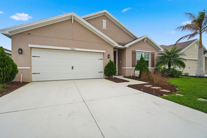 Welcome to this beautifully maintained 4-bedroom, 2-bathroom single-family home located in the highly desirable community of Port St. Lucie. Built in 2020, this modern residence offers the perfect combination of contemporary design, functionality, and move-in-ready convenience.  The open floor plan features spacious living and dining areas, ideal for both everyday living and entertaining. The split-bedroom floor plan provides added privacy, with a generously sized primary suite offering a relaxing retreat, complete with a private en-suite bathroom. Three additional bedrooms provide flexibility for family. Enjoy Florida living at its finest with a covered patio and backyard space. Conveniently located near shopping, dining, schools, and major highways.