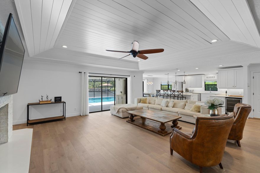 WOW! GORGEOUS LAKEFRONT POOL HOME IN FULLY GATED FRENCHMEN'S LANDING. THIS 3 BDR, 2 1/2 BATH HOME BOASTS A SEPARATE, DEDICATED OFFICE/DEN/MEDIA ROOM AND AN OPEN FLOOR PLAN WITH WHITE SHAKER CABINETRY, QUARTZ COUNTERTOPS, AND LOVELY WOOD BURNING FIREPLACE. FULLY RETRACTABLE GLASS SLIDERS IN THE LIVING ROOM, DINING ROOM AND MASTER BEDROOM ALL OPEN TO THE PRIVATE POOL AND PATIO AREA. FROM HERE YOU WILL ENJOY BEAUTIFUL SOUTHWEST SUNSET VIEWS OVERLOOKING THE GAZEBO, LAKE AND FOUNTAIN. ADDITIONALLY, THIS HOME INCLUDES ACCESS TO FRENCHMEN'S LANDING'S PRIVATE TENNIS AND BASKETBALL COURTS, CHILDREN'S PARK AND LIGHTED WALK/RUN PATHS. UNBEATABLE LOCATION CLOSE TO EVERYTHING - DINING, BEACHES, SHOPPING, GARDENS MALL, I-95. THIS ONE IS A GEM IN EVERY WAY!