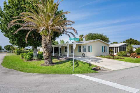 Photo of 3800 Spatterdock Lane, Port Saint Lucie, FL 34952 (MLS # B26026842)