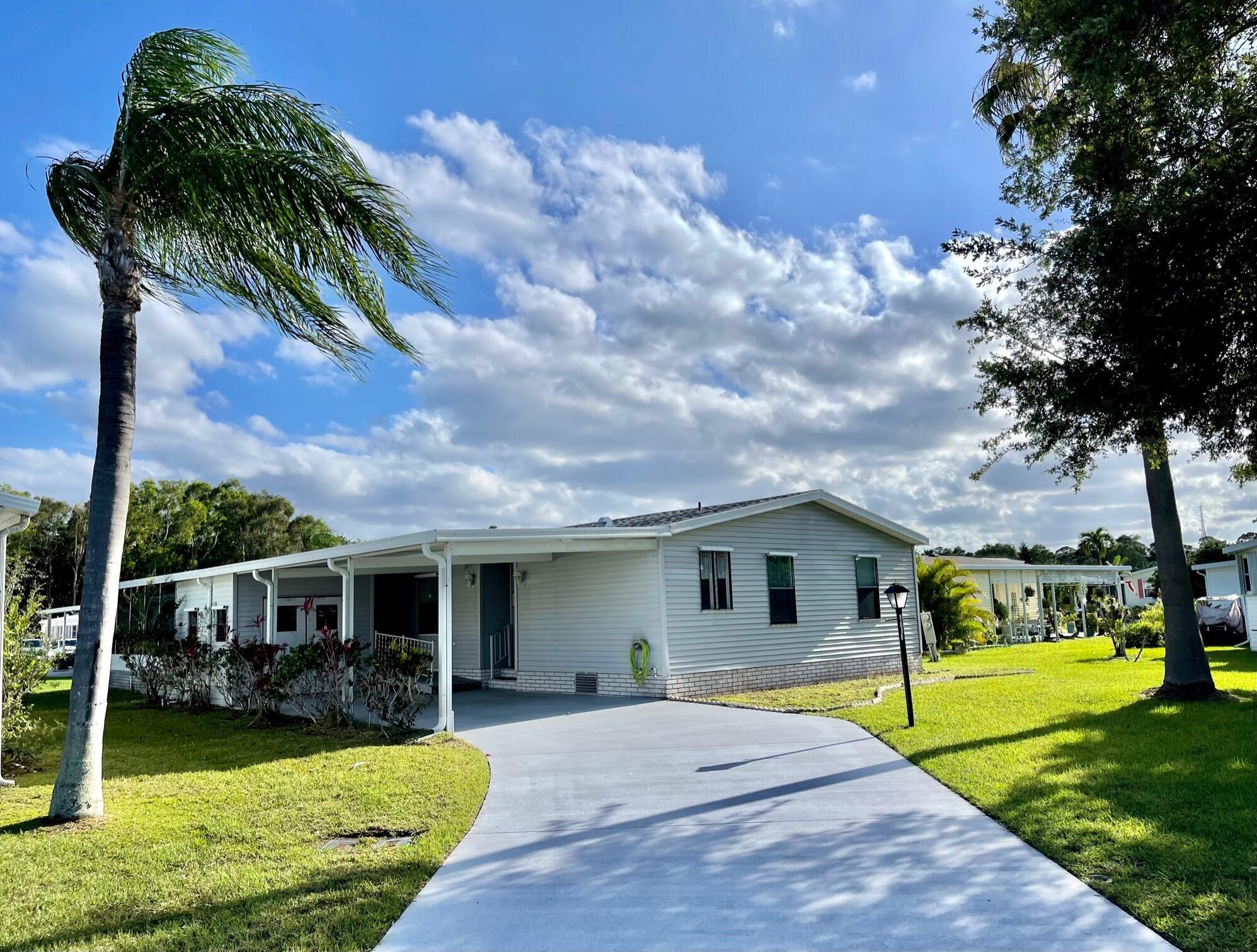 LAND OWNED home in the resort like lifestyle of Savanna Club! New roof 2022, New A/C 2021, Newer D/W & garbage disposal, wider doorways with a handicap ramp to lanai. Deep double door storage shed. Screened lanai w/doggie door. Master has deep closets along with large walk-in shower. HOA orientation required.