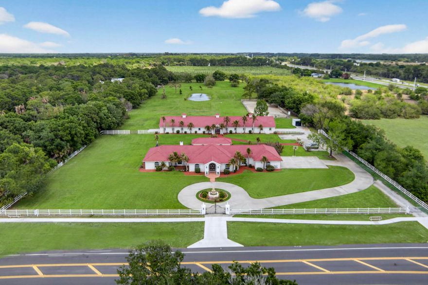 STATE OF THE ART EQUESTRIAN CENTER! A beautiful Spanish hacienda built to feel like you are in Sevilla Spain. Situated on 9.4 acres this gated FL ranch has a spacious main home w/pool, guest house & 19 stall barn w/top tier accommodations for breeding/boarding. Formally known as "Hacienda del Sol Andalusians" this exquisite ranch bred some of the worlds finest Andalusian horses. Barn equipped w/12x12 concrete block stalls, automatic waterers, swing in feeders, fans. Includes a feed room, tack room, laundry, office & medical area. Paddocks & dressage arena. 4bed/3bath main house. 1/1 Guest cottage and 4 car garage. Original owners. Pristine condition!  Artesian well on property. 4th bedroom in guest house.