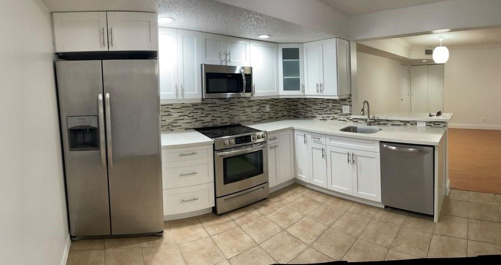 Photo of 5861 Riverside Drive #102A2, Coral Springs, FL 33067 (MLS # F10431587)