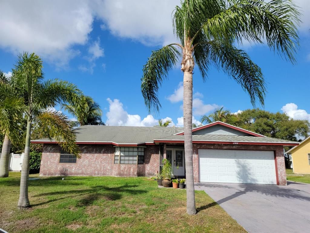 Photo of 2322 SW Norton Street, Port Saint Lucie, FL 34953 (MLS # R10782181)