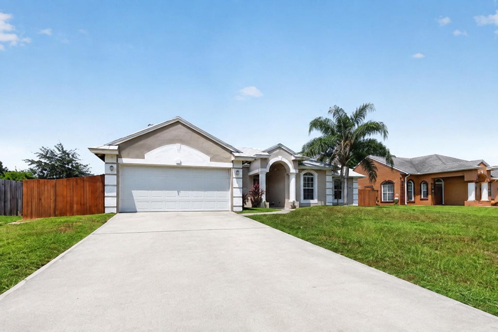 Photo of 1561 SW GADSAN Avenue, Port Saint Lucie, FL 34953 (MLS # B26065360)