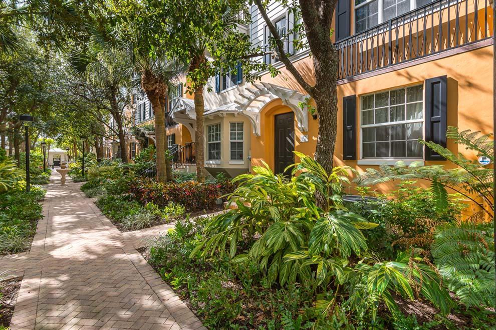 Enjoy the privacy and tranquility of this Mallory Square interior courtyard townhouse. The East Delray Beach townhouse offers three bedrooms and dynamic floor plan. The first floor has an en suite bedroom/office and two-car garage. The second floor has living room, dining area, stainless steel kitchen and powder room. The third floor has an additional en suite guest room and master suite with vaulted ceilings, large balcony, walk-in closet and master bath. Built in 2003 by Ironwood Properties, Mallory Square amenities include gated pool, sun deck and grilling area. The pet friendly community allows leasing with restrictions. Located just south of Atlantic Ave's shopping and dining and close to the beach, this is the perfect townhouse for year-round hassle free living or seasonal getaways.