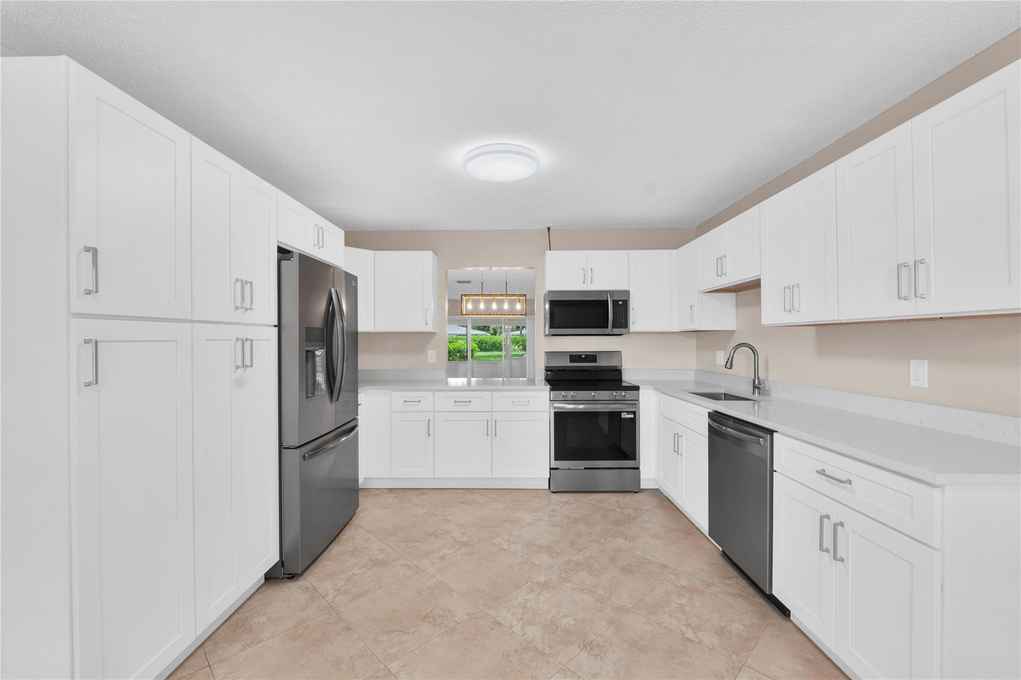 BRAND NEW KITCHEN! Beautiful 2Bed/2Bath villa-style condo in the lovely 55+ community of Bridgeview in Delray Beach! This spacious end-unit boasts oversized living & dining areas PLUS a newly renovated, large eat-in kitchen w/ quartz counters. Primary bedroom features new floors & large sitting room w/ windows, perfect for a home office or hobby room. Freshly painted interior, new electric panel, new lighting, new bathroom mirrors & more! With a reserved parking space by the front door & lots of greenspace, this gem is located in one of Bridgeview's best spots. The well-maintained, picture perfect community offers great amenities to swim, play tennis, pickleball, or stay active in the gym. With new roof & freshly painted exterior you can enjoy worry-free living for years to come!