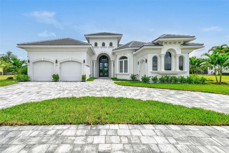 This home is a rare and exceptional find—one that rarely appears on the market—offering the craftsmanship of old-world construction paired with the sleek luxury of a brand-new residence. With nearly 4,000 square feet of single-story living, including four bedrooms, five bathrooms, a large two-car garage, and a separate golf cart garage, this property combines timeless architecture with a complete modern renovation that rivals new construction.

Inside, the home has been entirely remodeled. The home now presents the look and feel of a designer model home. Upon entry, the grand foyer and expansive living room set a dramatic tone with soaring ceilings and refined architectural detail. Every surface has been renewed, from the flooring and paint to trim, doors, and lighting.
