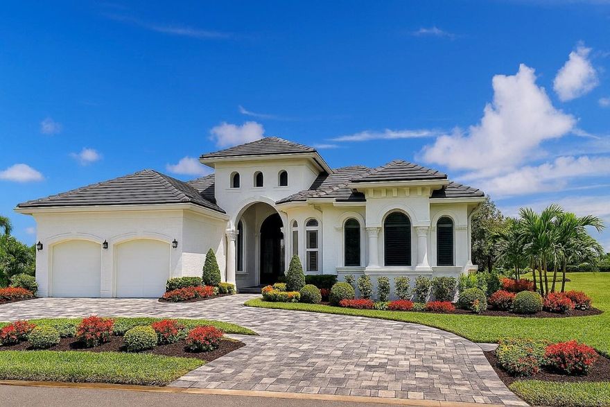 This rare Tesoro estate redefines single-story elegance, offering nearly 4,000 square feet of beautifully reimagined living space with four bedrooms, five bathrooms, and a two-car garage plus a separate golf cart garage. Every detail of this home has been renewed with the precision and design sensibility of a luxury model home—creating the perfect blend of classic Mediterranean architecture and sleek, modern sophistication.Step through the grand double doors into a sunlit foyer with soaring ceilings and architectural detailing that immediately impresses. The expansive living room opens seamlessly to the pool and golf course beyond, setting a tranquil, resort-like tone. Inside, no surface was left untouched—new flooring, lighting, trim, and paint pair with an all-new gourmet kitchen and five completely redesigned bathrooms, each finished with high-end materials and designer fixtures. The result is a home that feels fresh, elegant, and move-in ready at a truly exceptional level.The exterior has been equally transformed. The façade’s hand-crafted stonework and Mediterranean character remain, but now gleam with crisp white paint, a brand-new concrete tile roof, and all-new landscaping for a refined first impression. A new U-shaped paver driveway in modern gray and white tones leads to the garages, each finished with professional-grade epoxy floors that are both stunning and durable.Out back, your private resort awaits. New pavers surround a resurfaced pool with upgraded equipment, creating a luxurious outdoor space perfect for entertaining or simply relaxing amid serene water and golf course views. From the covered patio, enjoy peaceful sunsets overlooking Tesoro’s tranquil waterways and manicured greens—offering both beauty and privacy.This home is built for peace of mind. Constructed with solid concrete block, outfitted with impact-rated windows and doors, a new roof, and a whole-house Generac generator, it’s ready for any Florida weather.Located within Tesoro, Port St. Lucie’s premier private and manned golf community, residents enjoy a lifestyle of exclusivity and recreation. Club membership is optional and offers access to two championship golf courses, ten Har-Tru tennis courts, pickleball, a resort-style pool with cabana dining, a fine-dining clubhouse, and luxurious spa-like lounges.This home is more than a residence—it’s a statement of craftsmanship, comfort, and timeless design in one of Florida’s most prestigious communities.