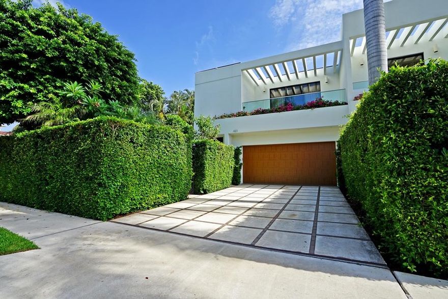 In-town location is central to everything! Contemporary style townhouse with private pool, 2-car garage, library and elevator.