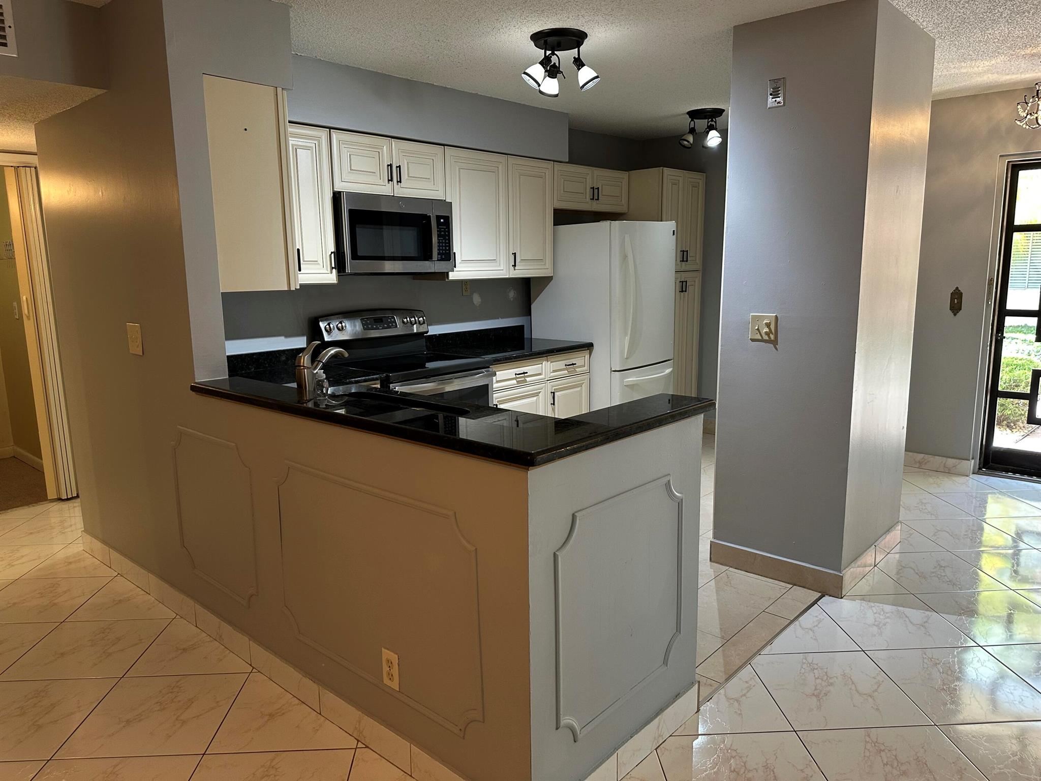 Lovely 2 Bed 2 Bath condo with washer/dryer on the 1st floor in 55+ community!! Beautiful condo, spacious with open floor plan allowing for lots of natural light and includes some great amenities such as: tile floors throughout, freshly painted, open kitchen with granite countertops and oversized kitchen cabinets, nicely updated bathrooms, oversized master closet, privacy shutters, plus washer/dryer and storage room. The unit is overlooking serene garden where you can enjoy the afternoon sunsets and is steps away from the pool and car wash. Located just minutes from downtown Delray and beach, shopping, entertainment, great dinning, and good hwy access to i95 & Turnpike. Come see it, will not last!