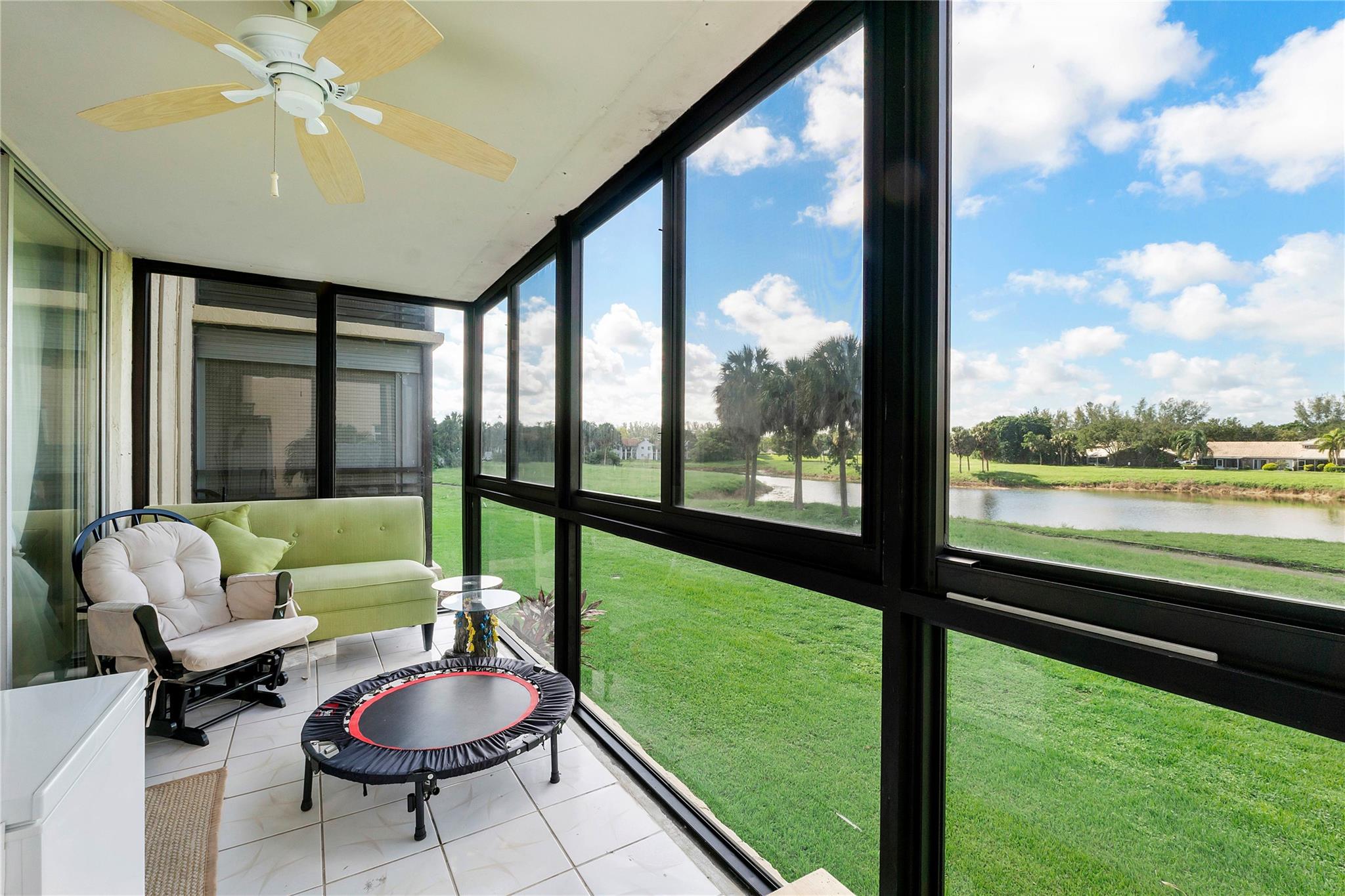 Welcome to this upgraded private corner unit on the second floor of Holiday Springs, a desirable 55+ community. Enjoy serene and private lake views right from your home. This condo features wood flooring, upgraded hurriance impact windows throughout, a modern quartz countertop with stainless steel appliances, a 2018 water heater, and a new 2024 AC system. Washer and Dryer inside the unit. Holiday Springs offers a vibrant lifestyle with a clubhouse, resort-style pool, and a wide range of amenities for your enjoyment.