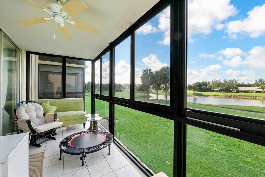 Welcome to this upgraded private corner unit on the second floor of Holiday Springs, a desirable 55+ community. Enjoy serene and private lake views right from your home. This condo features wood flooring, upgraded hurriance impact windows throughout, a modern quartz countertop with stainless steel appliances, a 2018 water heater, and a new 2024 AC system.  Washer and Dryer inside the unit.  Holiday Springs offers a vibrant lifestyle with a clubhouse, resort-style pool, and a wide range of amenities for your enjoyment.