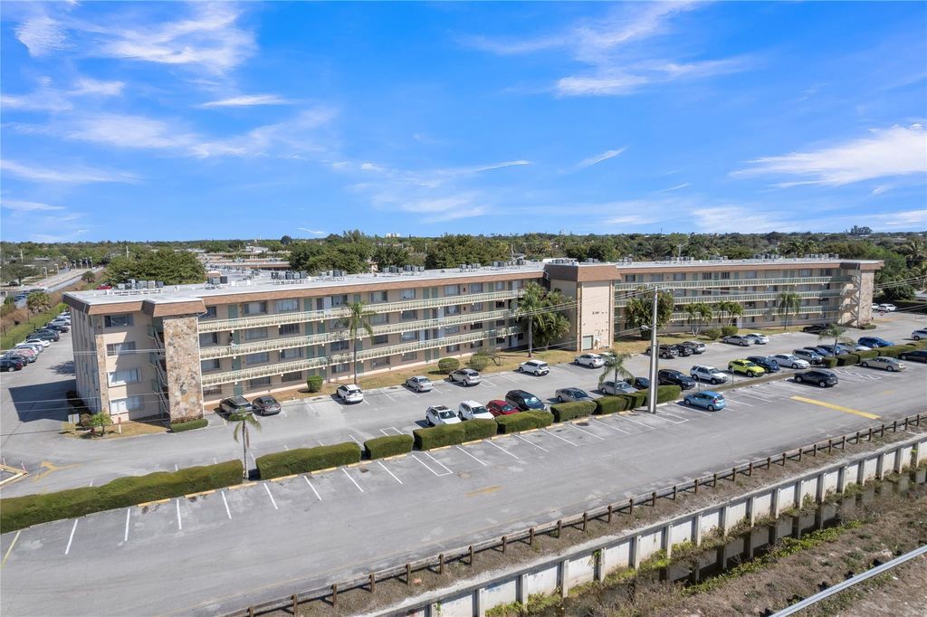 Photo of 300 Village Green Circle #210, Palm Springs, FL 33461 (MLS # F10554514)