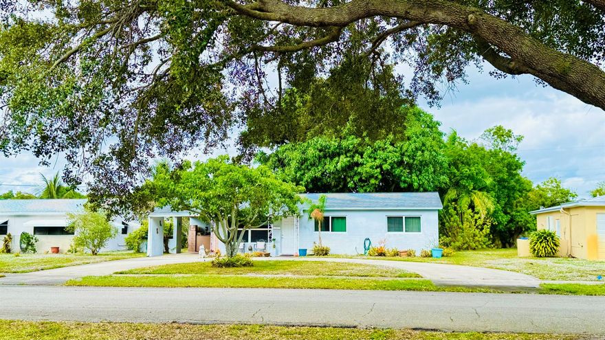 Discover charm, space, and the true Florida lifestyle in quiet location South of Northlake blvd and 1 block west of US1 which has great shopping! New construction and parks around, walk to Publix.. This inviting 3-bed, 1-bath home with carport sits on a sunny oversized lot filled with lush greenery, fruit trees, and a HUGE avocado tree that feels like your own private oasis. Enjoy morning walks under the palms, easy shopping and dining along US-1, or catch a show at Historic Downtown Lake Park's theater district just minutes away. A rare find with a beautiful yard and endless potential in a vibrant, fast-growing community--Plenty of outdoor space, natural light, and a prime location near everything. A rare rental opportunity in one of Palm Beaches most convenient and up-and-coming areas