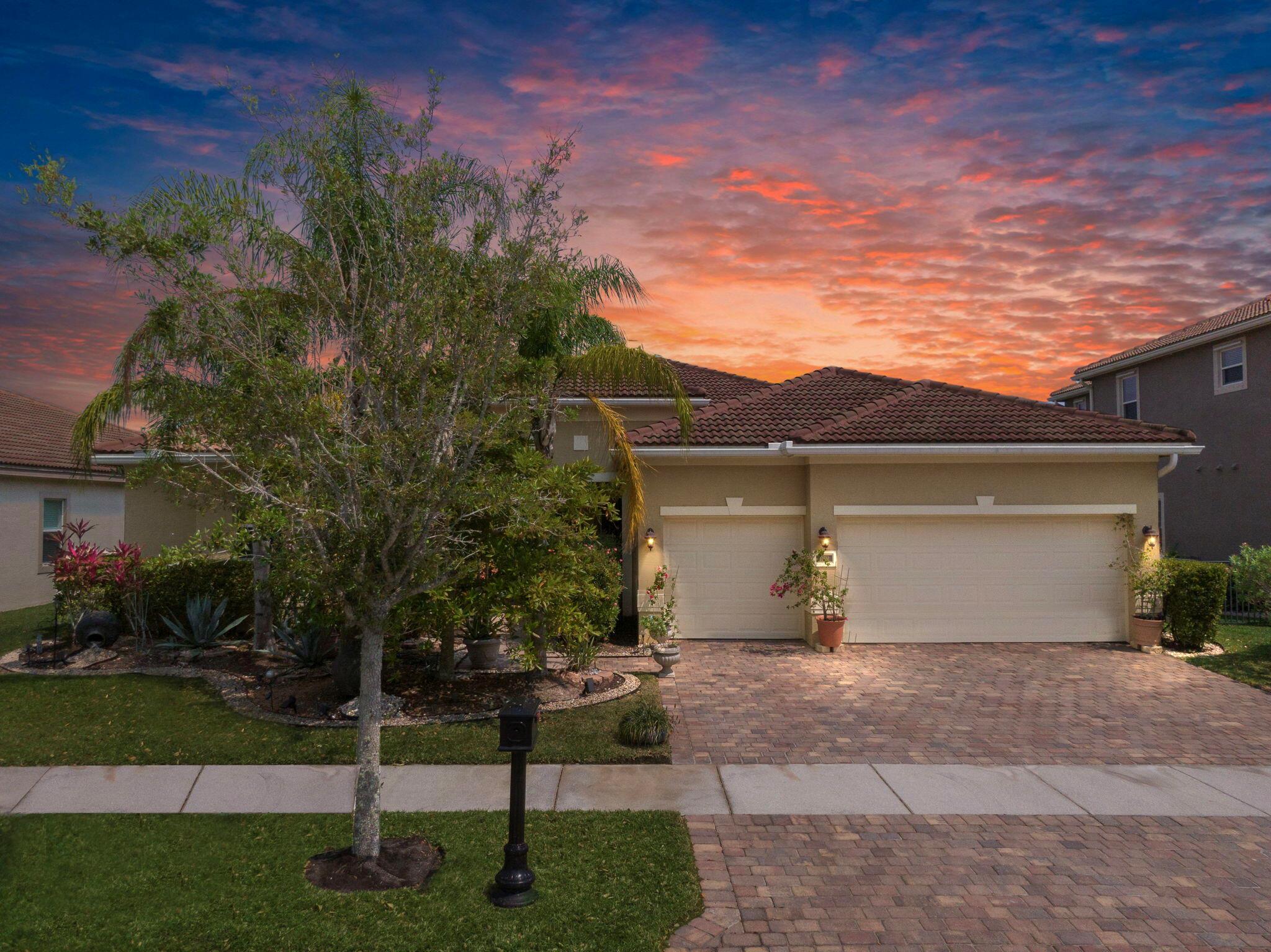 Discover refined living at 11931 SW Aventino Dr, Port St. Lucie, FL! This elegant 4-bedroom, 3-bathroom home offers 3,448 sq ft of luxurious space with a 3-car garage on a spacious lot. Nestled in the highly sought-after community of Tradition, this home provides the perfect blend of comfort and convenience. Tradition is known for its charming town center, scenic parks, and vibrant community events. With easy access to shopping, dining, and top-rated schools, this home is ideal for those seeking a relaxed yet connected lifestyle. Don't miss your chance to own a piece of paradise in one of Port St. Lucie's most desirable neighborhoods!