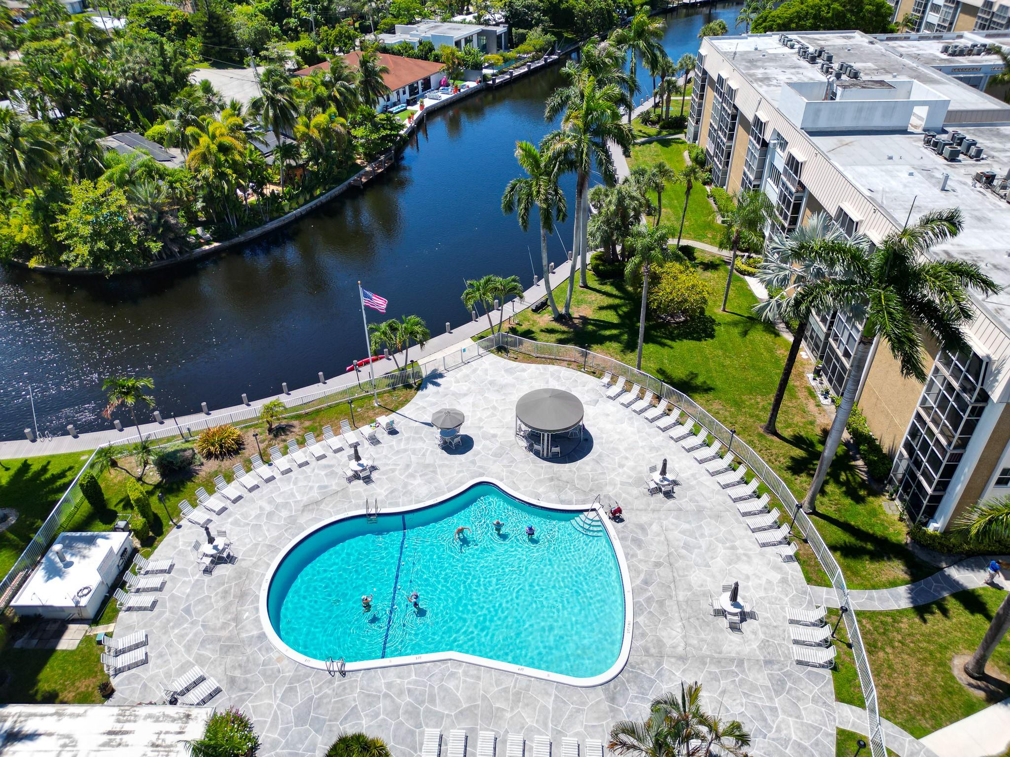 A gorgeous, remodeled, top floor 2 bed/2 bath penthouse with south views of Middle River and Downtown Fort Lauderdale. It's one of the only gated condo communities in the area. Everything in the unit is modern and finished to a high standard - from the open plan kitchen to the bathrooms with a new balcony. Dropped ceiling wired for lighting and speakers. Facilities for River Terrace residents include the pool/spa patio area, tennis court, and a beautiful river path with the option of kayaking. The unit is conveniently located for all the restaurants, bars, coffee shops, and entertainment of Wilton Drive. Water and basic cable are included in the HOA. AC is 10-12 years old. 50 year certification completed. Fully funded Reserves.