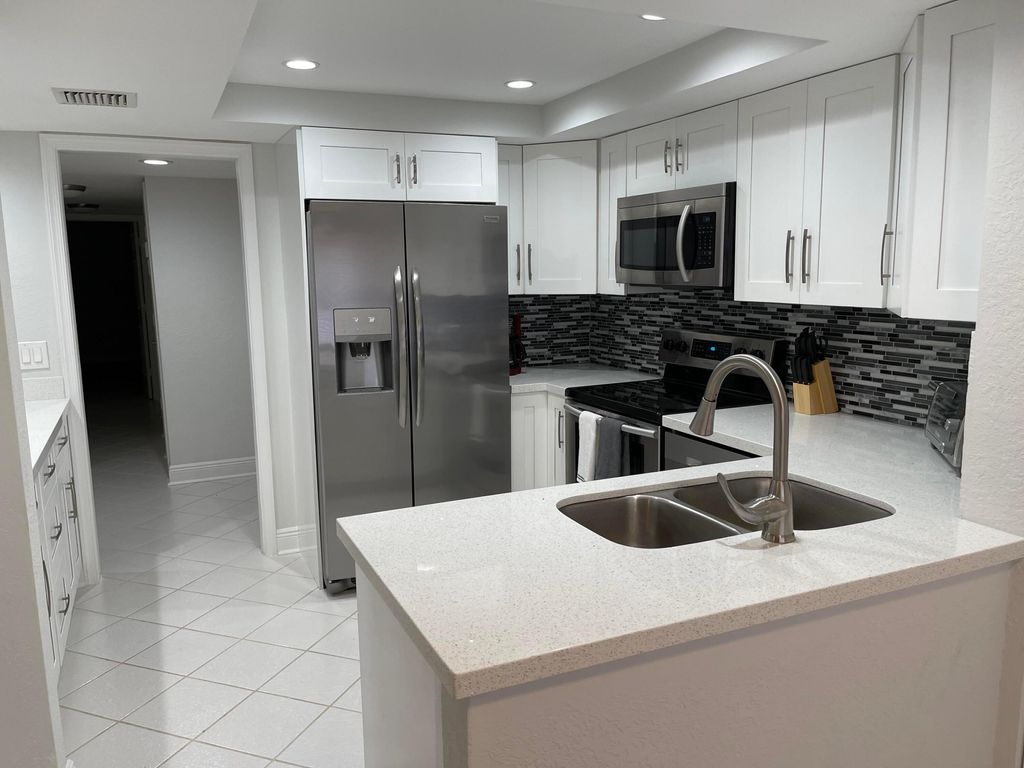 Photo of 1660 Twelve Oaks Way #203, North Palm Beach, FL 33408 (MLS # R10942295)