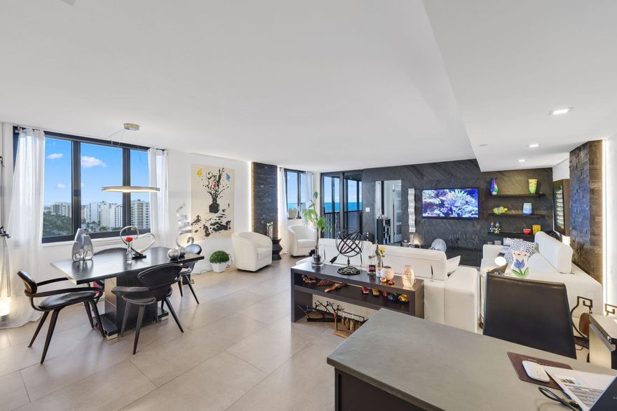 Exceptional Coronado penthouse in the premier stack--an architectural masterpiece and true designer's dream home. Solid porcelain tile with a sleek concrete design flows throughout, complemented by custom built-ins and striking quartzite wall features. Unique lighting and design elements create a refined, museum-like atmosphere balanced by warm, natural tones and solid white marble countertops. Bedrooms feature premium engineered wood floors for added comfort and style. With wraparound ocean-to-city views from every window and an expansive balcony, this residence embodies sophisticated coastal living. Every inch of this home has been thoughtfully curated with precision craftsmanship. A rare opportunity to own a one-of-a-kind Coronado Penthouse.