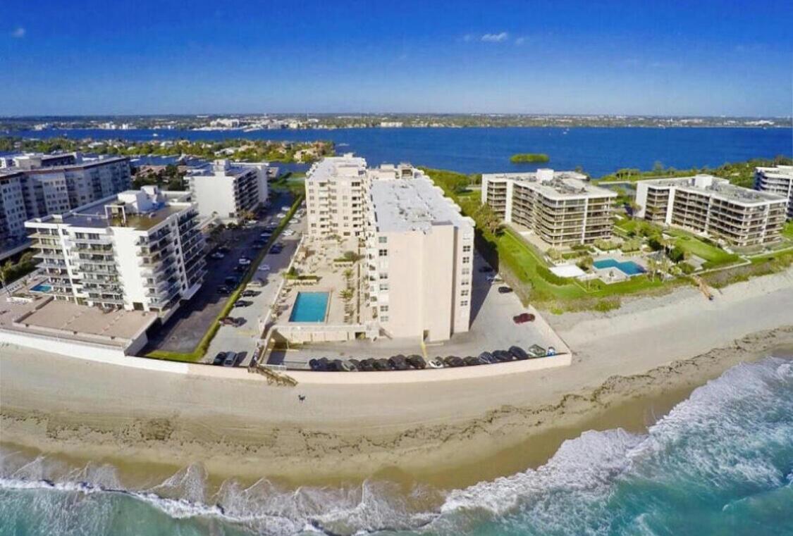 Dynamite 1 bedroom 1.5 bath condo for sale located beach front in beautiful Palm Beach. This unit is unique with its spacious layout, huge custom closet, updated kitchen and appliances, and brand new flooring. Watch the sun set from the balcony while viewing the intracoastal waterway and walk on the private beach to see the sun rise. This condominium is stunning. The Patrician of Palm Beach went under a complete renovation and amenities include a 24 hour gym, a library, card room, beautiful beach front lap pool, and private access to the Patrician's own deeded beach. Installation of in unit washer and dryer is allowed. If your dream is to live on the beach then you must see this sizeable unit with the best layout in the building!