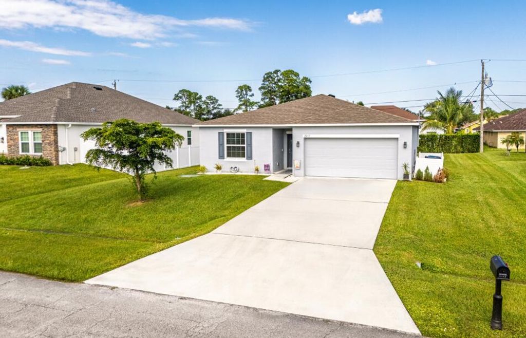 Photo of 2217 SW Crocus Lane, Port Saint Lucie, FL 34953 (MLS # R11136389)