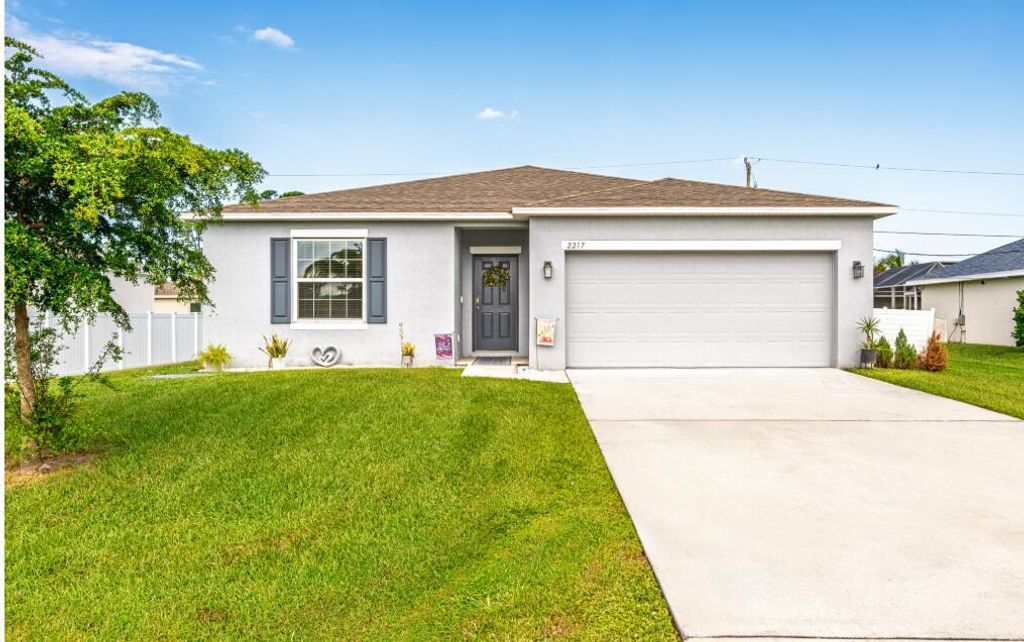 Photo of 2217 SW Crocus Lane, Port Saint Lucie, FL 34953 (MLS # R11136389)