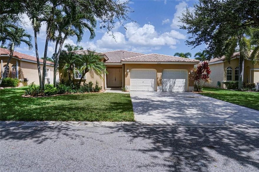 THERE'S NOTHING LIKE HOME-SWEET-HOME!  Your family will love the OPEN KITCHEN, GLEAMING PORCELAIN TILE FLOORS and LAKE VIEW in an excellent GATED community with GOOD SCHOOLS. High ceilings! Newer fridge and washer/dryer, two car garage with plenty of parking.  TRIPLE SPLIT floor plan so everyone has lots of privacy, master suite includes walk-in closet, and bathroom has dual sinks, jacuzzi tub and separate shower!  Accordion hurricane shutters offer storm protection. Fenced on both sides. Enjoy the community pool!