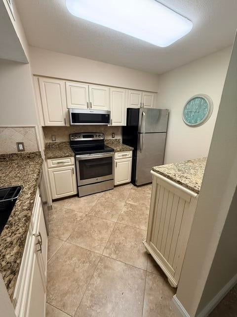Photo of 1035 LAKE SHORE Drive #103, Lake Park, FL 33403 (MLS # B26067835)